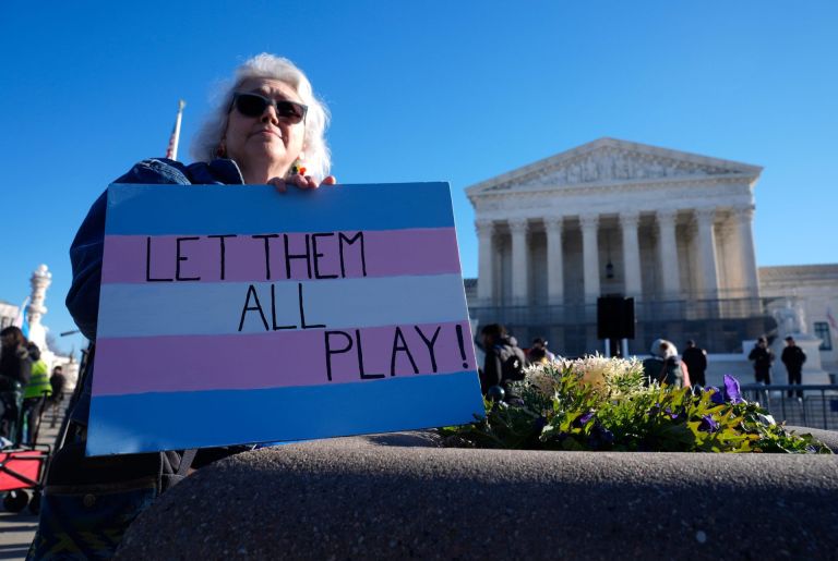 Demonstrators rally outside of the Supreme Court as the justices hear oral arguments in two cases related to transgender athlete participation in sports in Washington, DC, on Jan. 13, 2026. The cases, Little v. Hecox and West Virginia v. B.P.J., seek to decide whether laws that limit participation to women and girls based on sex violate the equal protection clause of the 14th Amendment.