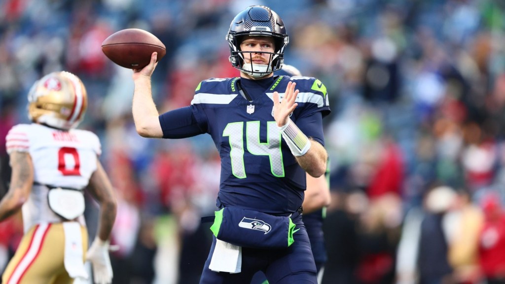 Jan 17, 2026; Seattle, WA, USA; Seattle Seahawks quarterback Sam Darnold (14) warms up prior to a game against the San Francisco 49ers in an NFC Divisional Round game at Lumen Field