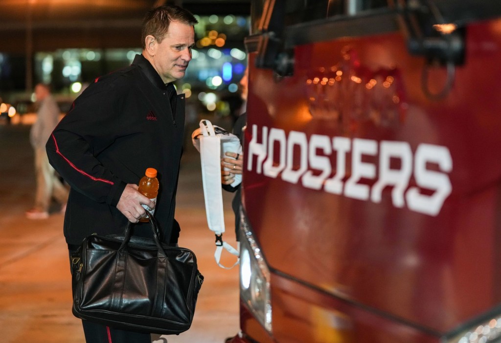Indiana Hoosiers head coach Curt Cignetti walks on to the bus Friday, Jan. 16, 2026, at the Miami Airport in Miami.
