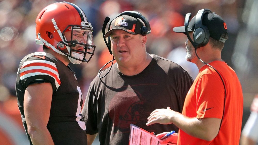 Browns quarterback Baker Mayfield meets with offensive coordinator Alex Van Pelt, center, and head coach Kevin Stefanski during the first half against the Houston Texans, Sunday, Sept. 19, 2021, in Cleveland.