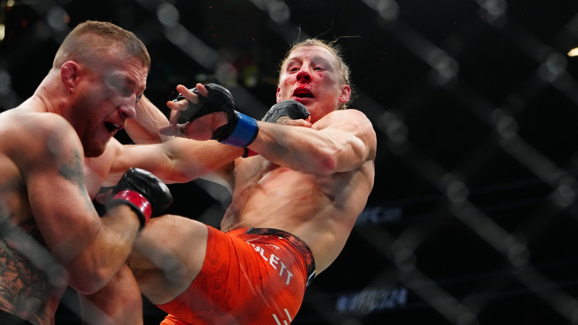 Jan 24, 2026; Las Vegas, Nevada, USA; Justin Gaethje (red gloves) fights Paddy Pimblett (blue gloves) during UFC 324 at T-Mobile Arena.