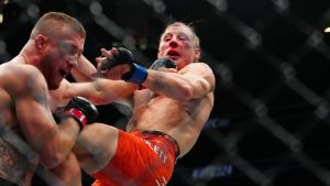 Jan 24, 2026; Las Vegas, Nevada, USA; Justin Gaethje (red gloves) fights Paddy Pimblett (blue gloves) during UFC 324 at T-Mobile Arena.