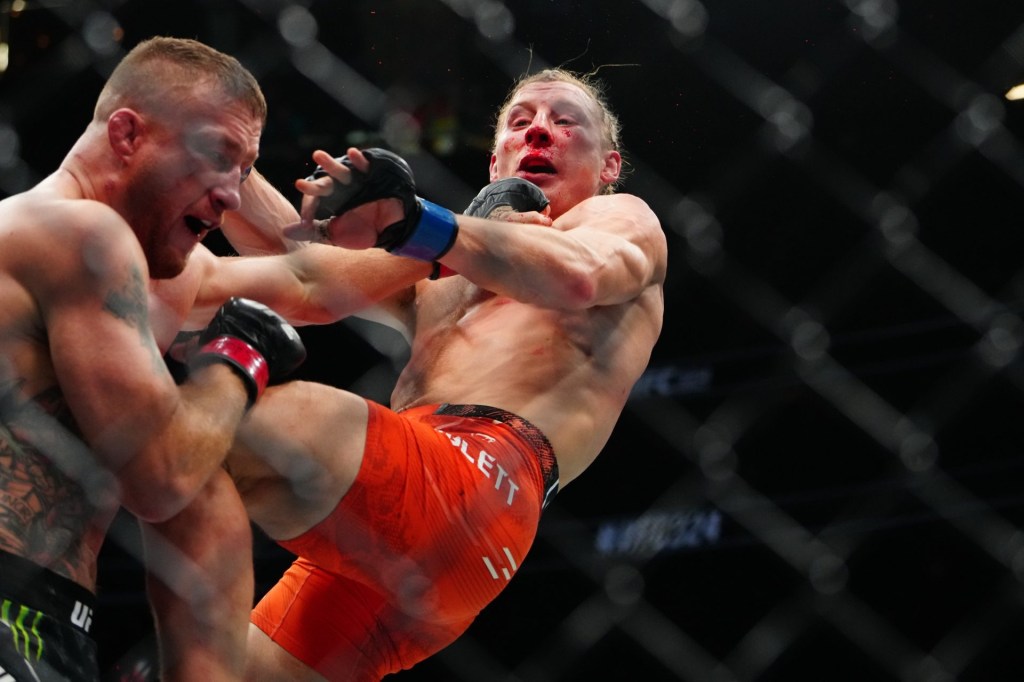 Jan 24, 2026; Las Vegas, Nevada, USA; Justin Gaethje (red gloves) fights Paddy Pimblett (blue gloves) during UFC 324 at T-Mobile Arena.