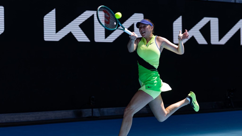 Jan 26, 2026; Melbourne, Victoria, Australia; Amanda Anisimova of United States in action against Xinyu Wang of China in the fourth round of the womens singles at the Australian Open at John Cain Arena in Melbourne Park.