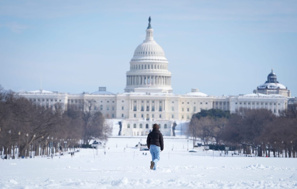 The United States Capitol and The National Mall covered in snow on Jan. 26, 2026 as Washington, DC digs out after a power winter storm with snow and sleet and very cold temperatures.