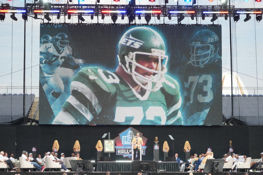 Aug 5, 2023; Canton, OH, USA; New York Jets and Indianapolis Colts former defensive lineman Joe Klecko speaks after unveiling his bust during the 2023 Pro Football Hall of Fame Enshrinement at Tom Benson Hall of Fame Stadium.