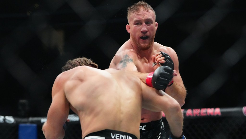 Mar 8, 2025; Las Vegas, Nevada, USA; Justin Gaethje (red gloves) fights Rafael Fiziev (blue gloves) during UFC 313 at T-Mobile Arena. Mandatory Credit: Stephen R. Sylvanie-Imagn Images