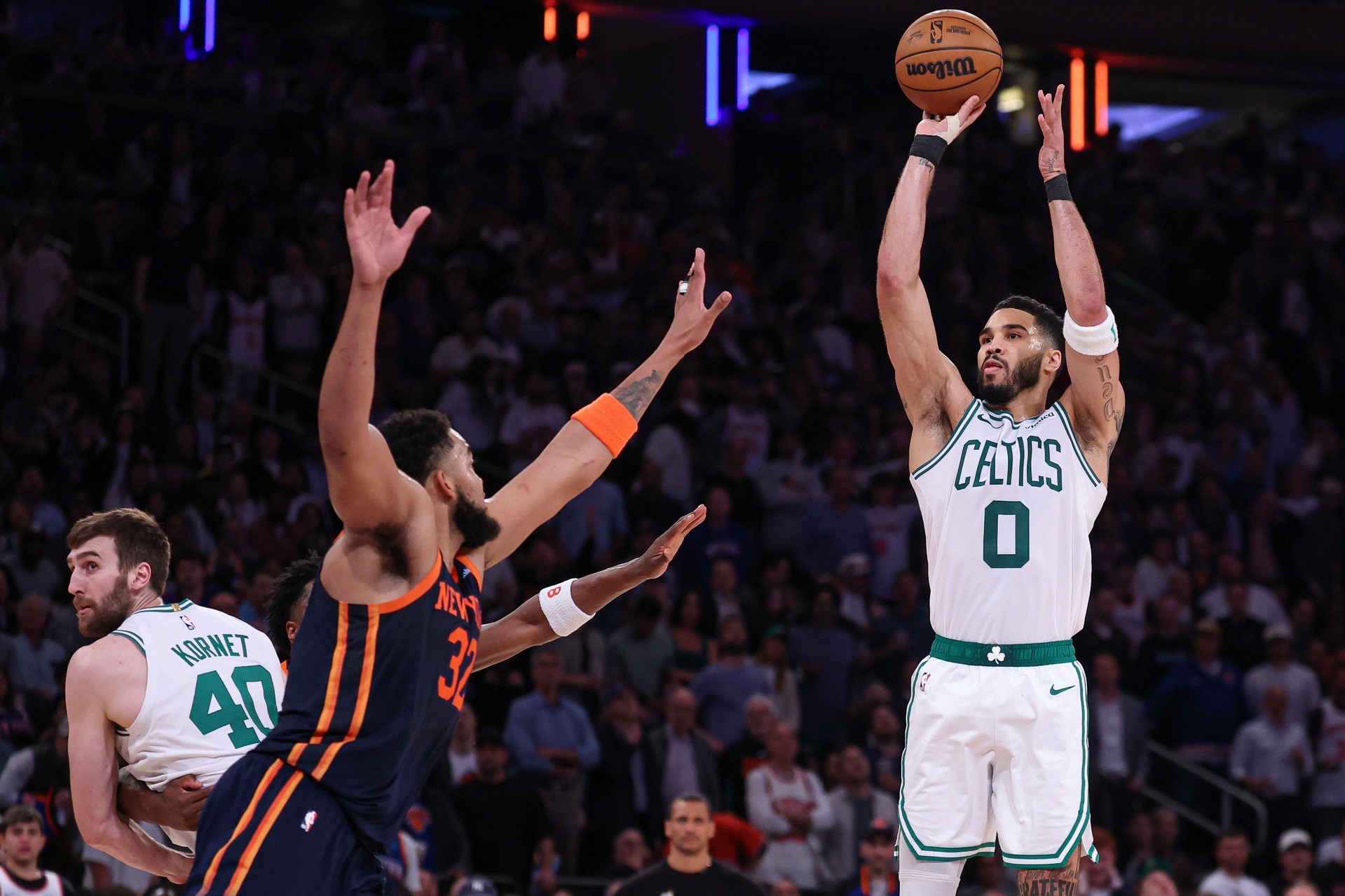 May 12, 2025; New York, New York, USA; Boston Celtics forward Jayson Tatum (0) shoots the ball as New York Knicks center Karl-Anthony Towns (32) defends in the second half during game four of the second round for the 2025 NBA Playoffs at Madison Square Garden.