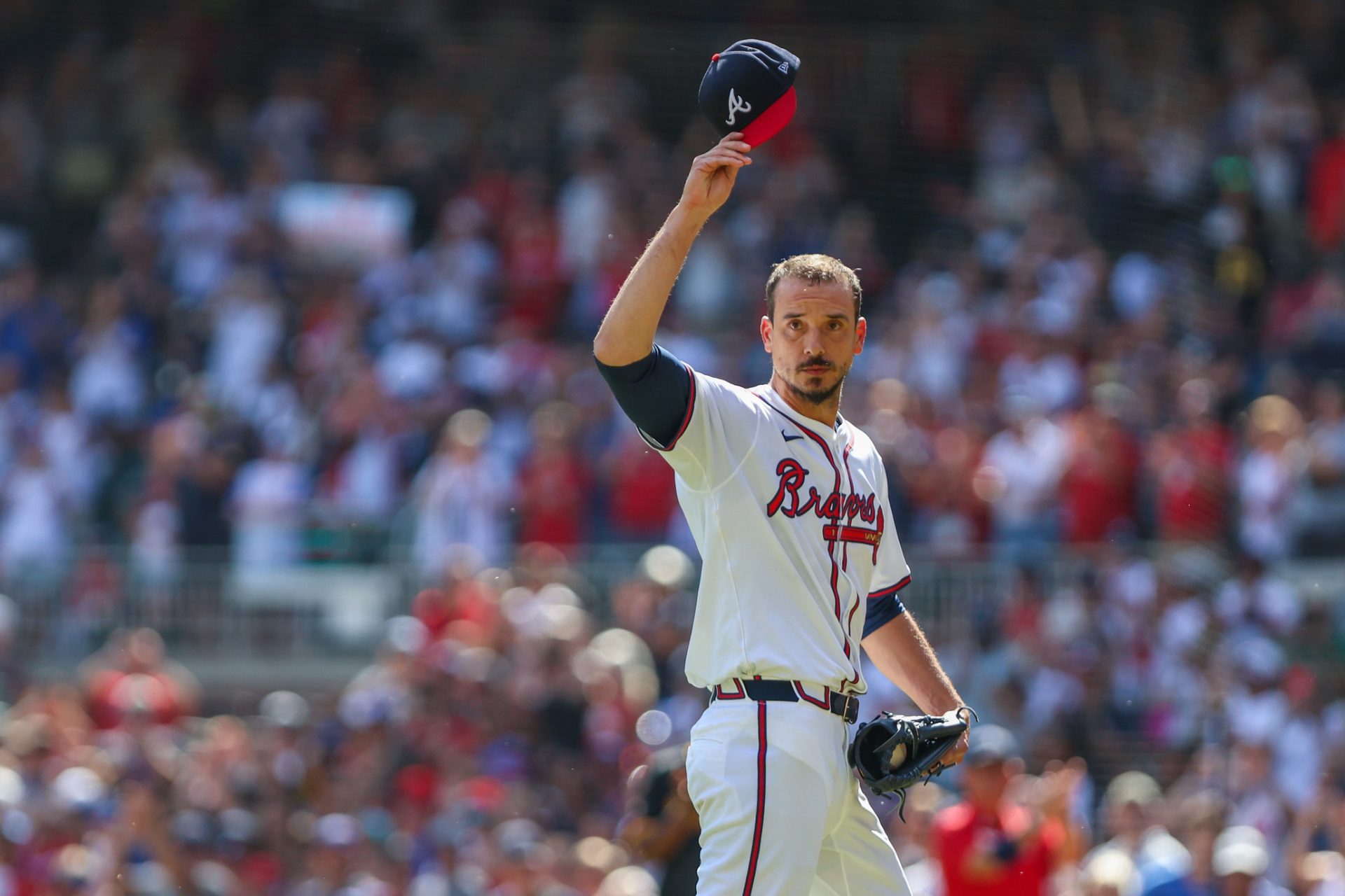 Sep 28, 2025; Cumberland, Georgia, USA; Atlanta Braves pitcher Charlie Morton (50) waves to fans while walking to the dugout after pitching against the Pittsburgh Pirates during the second inning at Truist Park.