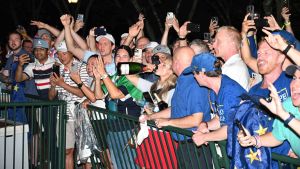 Sep 28, 2025; Bethpage, New York, USA; The crowd drinks champagne in the celebration for Europe winning the Ryder Cup at Bethpage Black. Mandatory Credit: Dennis Schneidler-Imagn Images