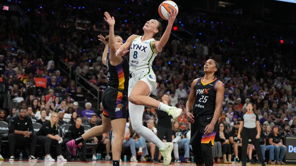 Sep 28, 2025; Phoenix, Arizona, USA; Minnesota Lynx forward Alanna Smith (8) scores on Phoenix Mercury forward Kathryn Westbeld (24) and forward Alyssa Thomas (25) in the second half during game four of the second round for the 2025 WNBA Playoffs at PHX Arena.
