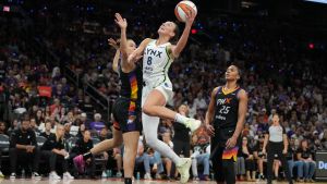 Sep 28, 2025; Phoenix, Arizona, USA; Minnesota Lynx forward Alanna Smith (8) scores on Phoenix Mercury forward Kathryn Westbeld (24) and forward Alyssa Thomas (25) in the second half during game four of the second round for the 2025 WNBA Playoffs at PHX Arena.