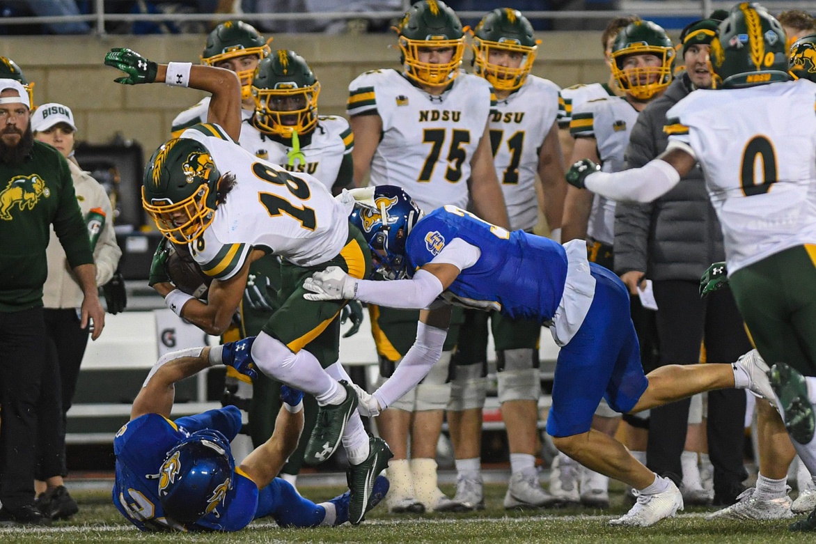 North Dakota State Bison wide receiver Jackson Williams (18) gets tackled on the sideline while playing against the South Dakota State Jackrabbits on Saturday, Oct. 25, 2025, at Dana J. Dykhouse Stadium in Brookings, South Dakota.