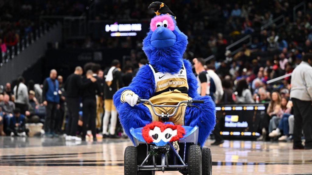 Dec 28, 2025; Washington, District of Columbia, USA; Washington Wizards mascot G-Wiz on the court against the Memphis Grizzlies during the second half at Capital One Arena.