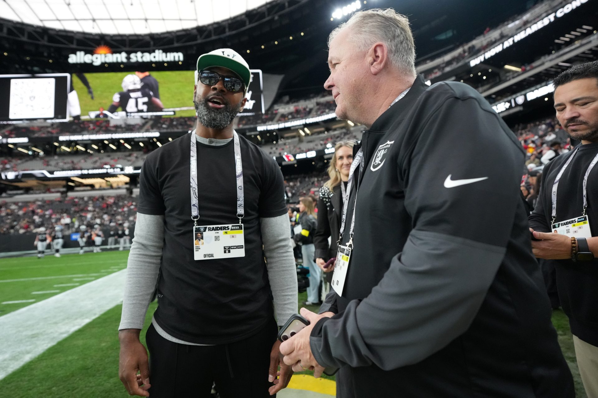 Jan 4, 2026; Paradise, Nevada, USA; Charles Woodson (left) and JT the Brick aka John Tournour attend the game between the Las Vegas Raiders and the Kansas City Chiefs at Allegiant Stadium.