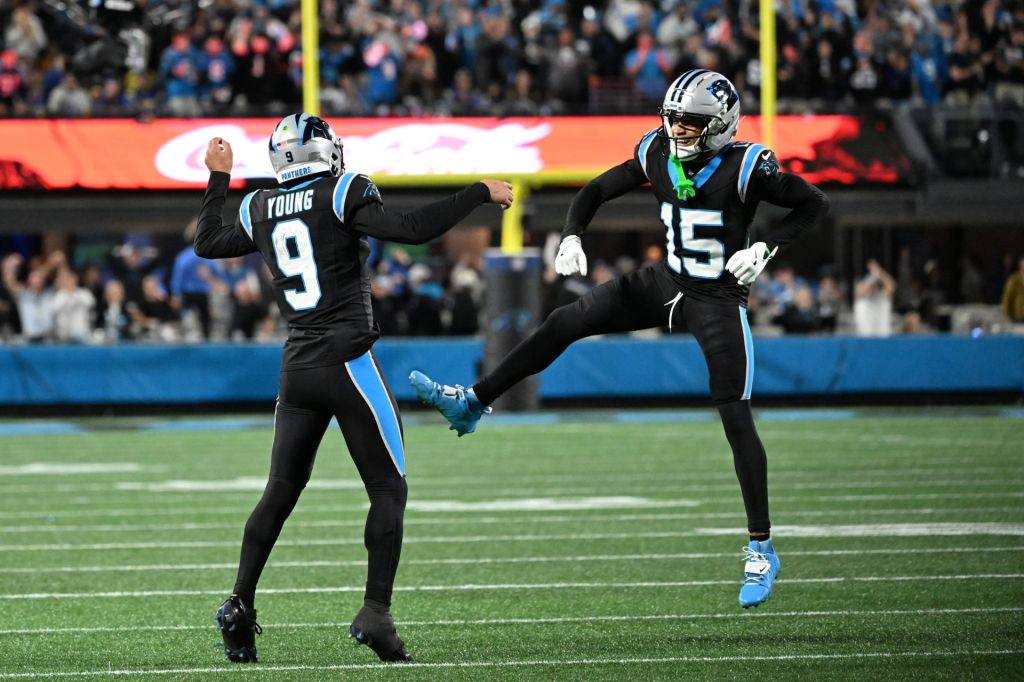 Jan 10, 2026; Charlotte, NC, USA; Carolina Panthers quarterback Bryce Young (9) and wide receiver Jimmy Horn Jr. (15) reacts in the fourth quarter in an NFC Wild Card Round game at Bank of America Stadium.