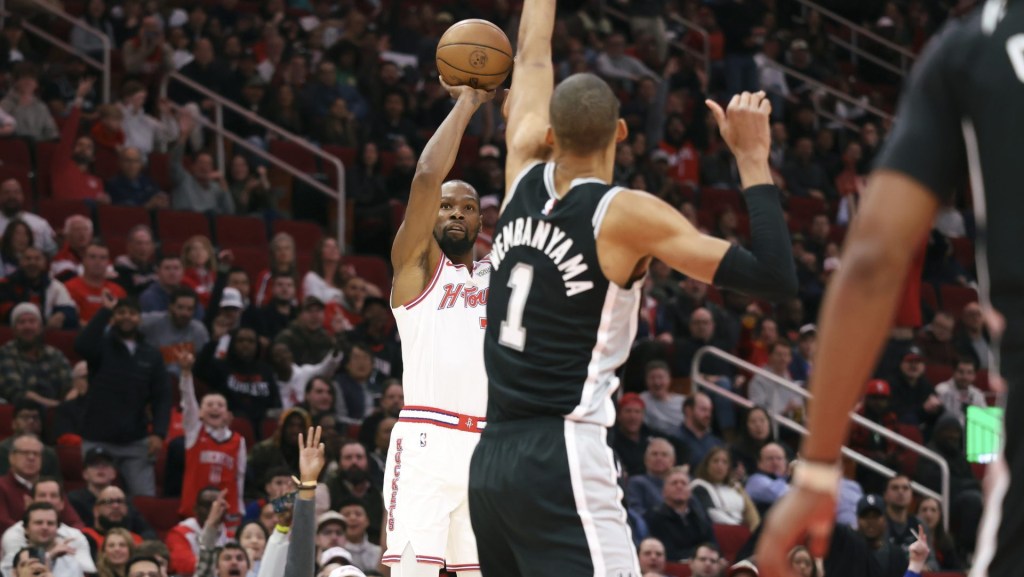 Jan 28, 2026; Houston, Texas, USA; Houston Rockets forward Kevin Durant (7) shoots the ball as San Antonio Spurs forward Victor Wembanyama (1) defends during the first quarter at Toyota Center.