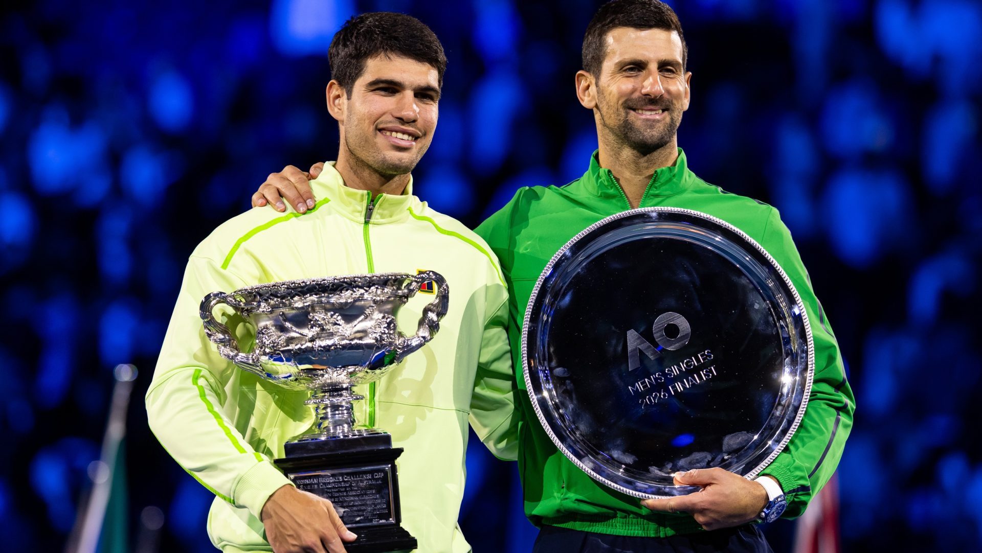 Feb 01, 2026; Melbourne, Victoria, Australia; Carlos Alcaraz of Spain and Novak Djokovic of Serbia during the trophy presentation after the final of the mens singles at the Australian Open at Rod Laver Arena in Melbourne Park.