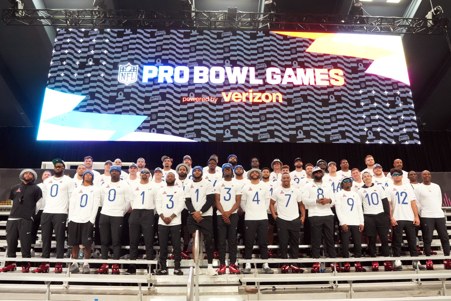 Feb 1, 2026; San Francisco, CA, USA; NFC players and coaches pose for team photo at the Flag Fieldhouse Moscone Center South Building.