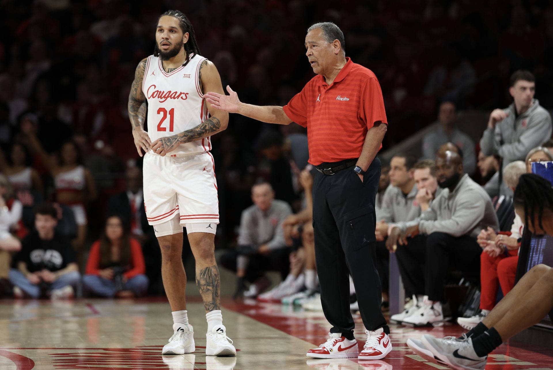 Feb 4, 2026; Houston, Texas, USA; Houston Cougars head coach Kelvin Sampson talks to guard Emanuel Sharp (21) in the first half against the UCF Knights at Fertitta Center.