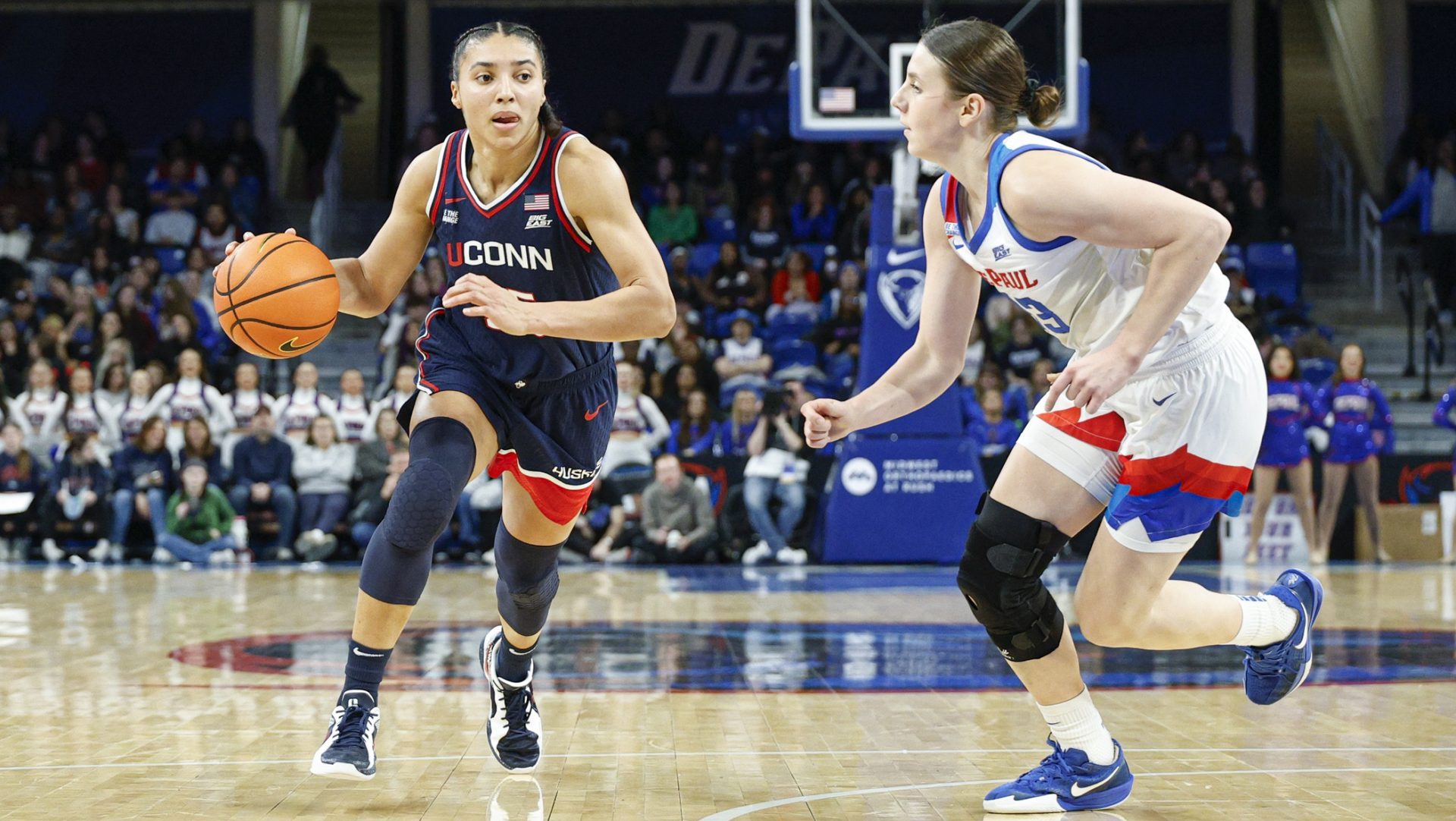 Feb 4, 2026; Chicago, Illinois, USA; UConn Huskies guard Azzi Fudd (35) drives to the basket against DePaul Blue Demons guard Kate Novik (33) during the first half at Wintrust Arena.