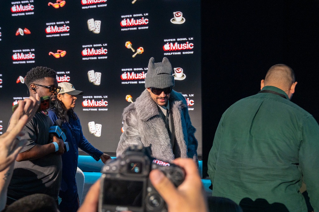 Bad Bunny high fives journalists following his Super Bowl 60 halftime show press conference. Feb. 5, 2026.