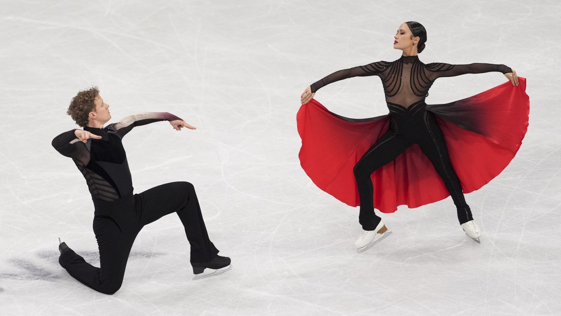 Feb 11, 2026; Milan, Italy; Madison Chock and Evan Bates of the United States skate during the Milano Cortina 2026 Olympic Winter Games at Milano Ice Skating Arena.