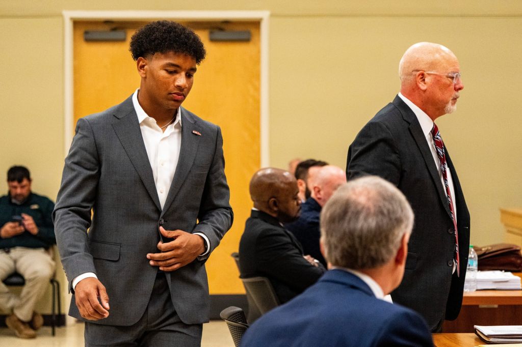 Ole Miss quarterback Trinidad Chambliss returns to his seat after testifying during the hearing in his lawsuit against the NCAA at Calhoun County Courthouse in Pittsboro, Miss., on Thursday, Feb. 12, 2026. Chambliss is looking for a temporary injunction and a permanent injunction against the NCAA for one more year of eligibility.