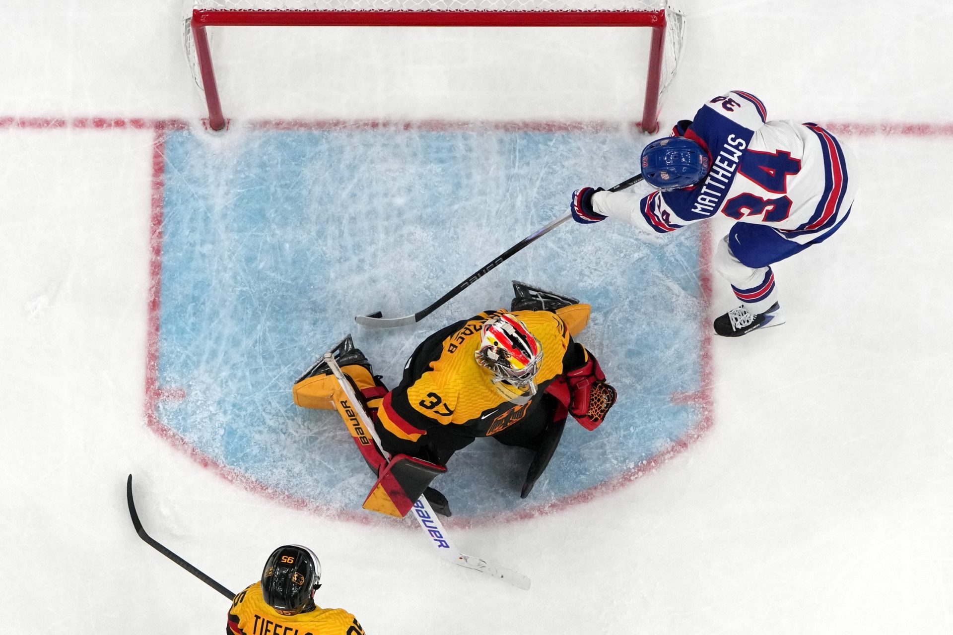 [US, Mexico & Canada customers only] Feb 15, 2026; Milan, Italy; Auston Matthews of United States scores their fifth goal past Maximilian Franzreb of Germany in men's ice hockey group A play during the Milano Cortina 2026 Olympic Winter Games at Milano Santagiulia Ice Hockey Arena.
