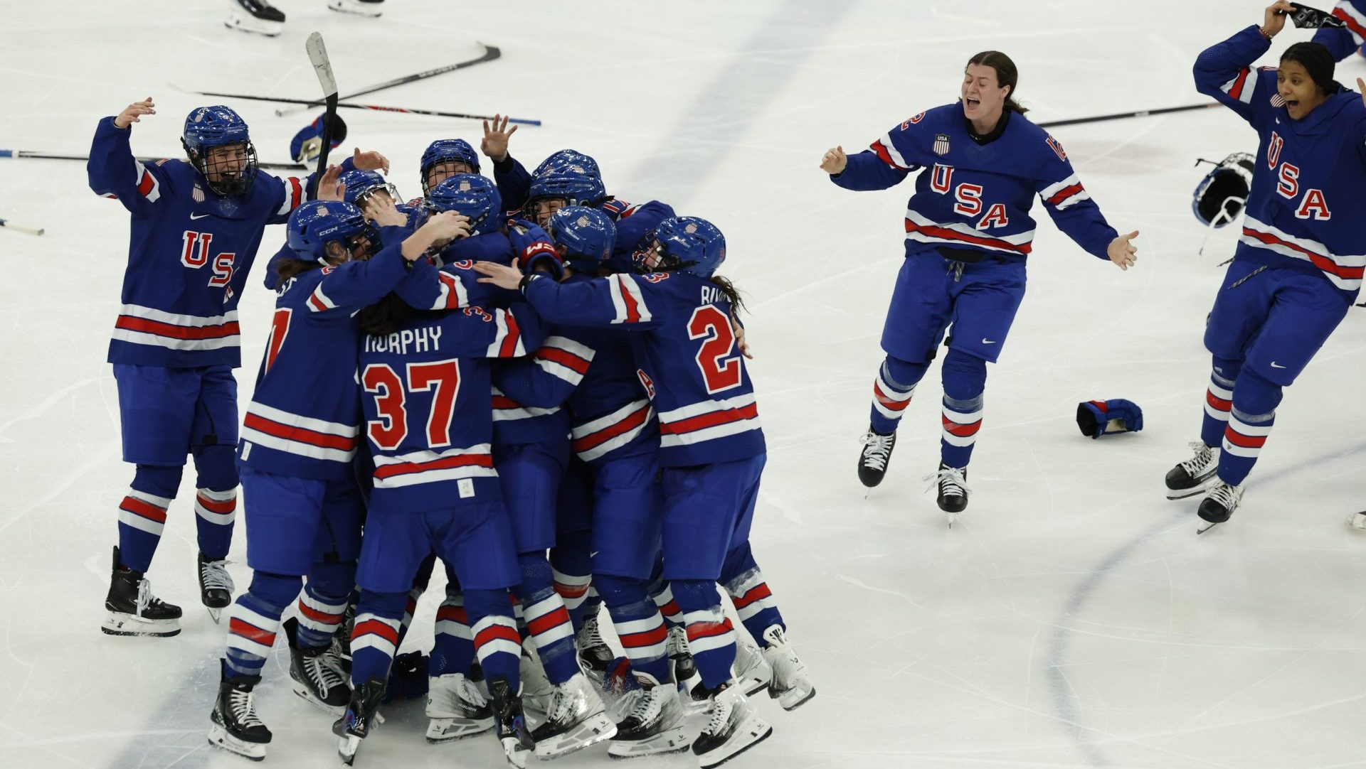 Feb 19, 2026; Milan, Italy; Team USA celebrates winning the gold medal in women’s ice hockey against Canada in overtime during the Milano Cortina 2026 Olympic Winter Games at Milano Santagiulia Ice Hockey Arena. Mandatory Credit: Geoff Burke-Imagn Images
