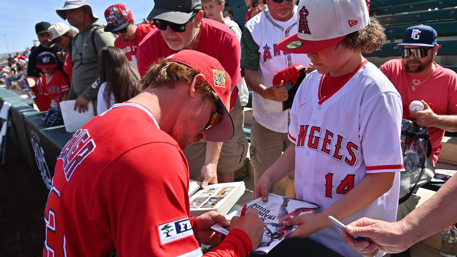 Feb 23, 2026; Tempe, Arizona, USA; Los Angeles Angels outfielder Wade Meckler (53) signs autographs prior to a spring training game against the Texas Rangers at Tempe Diablo Stadium.
