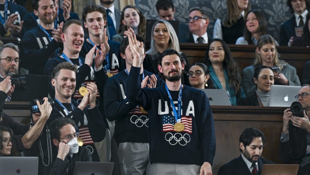 Feb 24, 2026; Washington, DC, USA; The United States Olympic Men’s Ice Hockey Team, Connor Hellebuyck in front, as President Donald J. Trump delivers the first State of the Union address of his second term to a joint session of Congress in the House Chamber of the United States Capitol in Washington on Tuesday