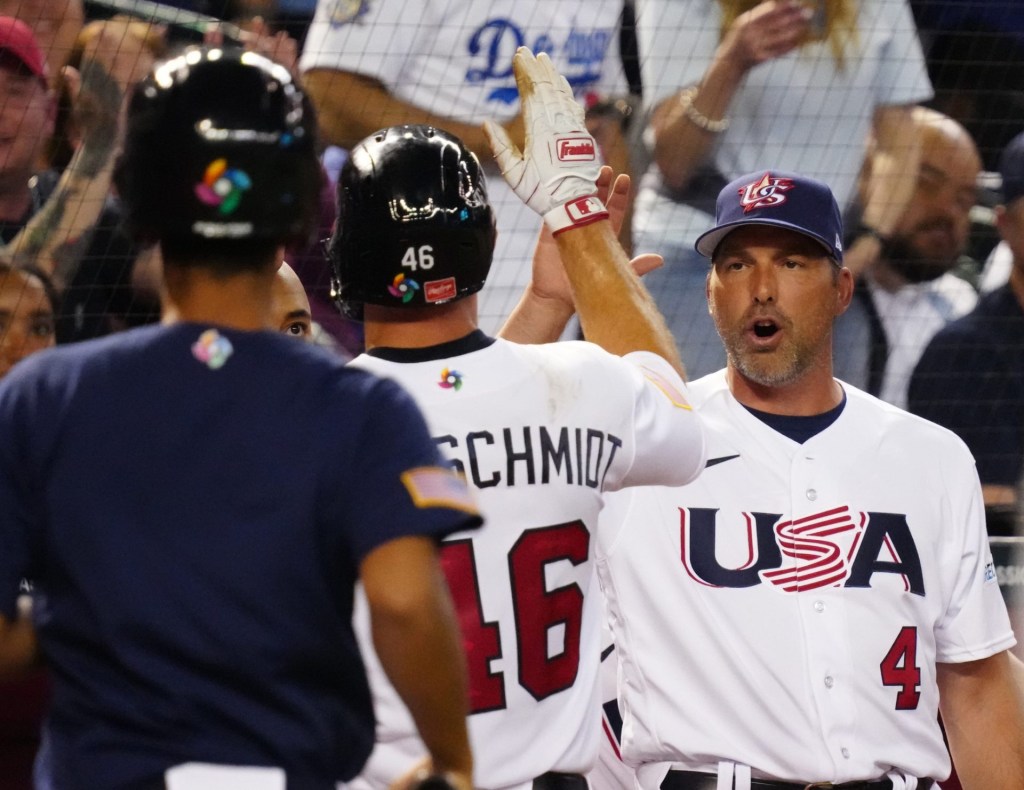 USA manager Mark DeRosa high-fives first baseman Paul Goldschmidt (46) during the World Baseball Classic against Great Britain at Chase Field in Phoenix on March 11, 2023. Baseball World Baseball Classic Opening Day