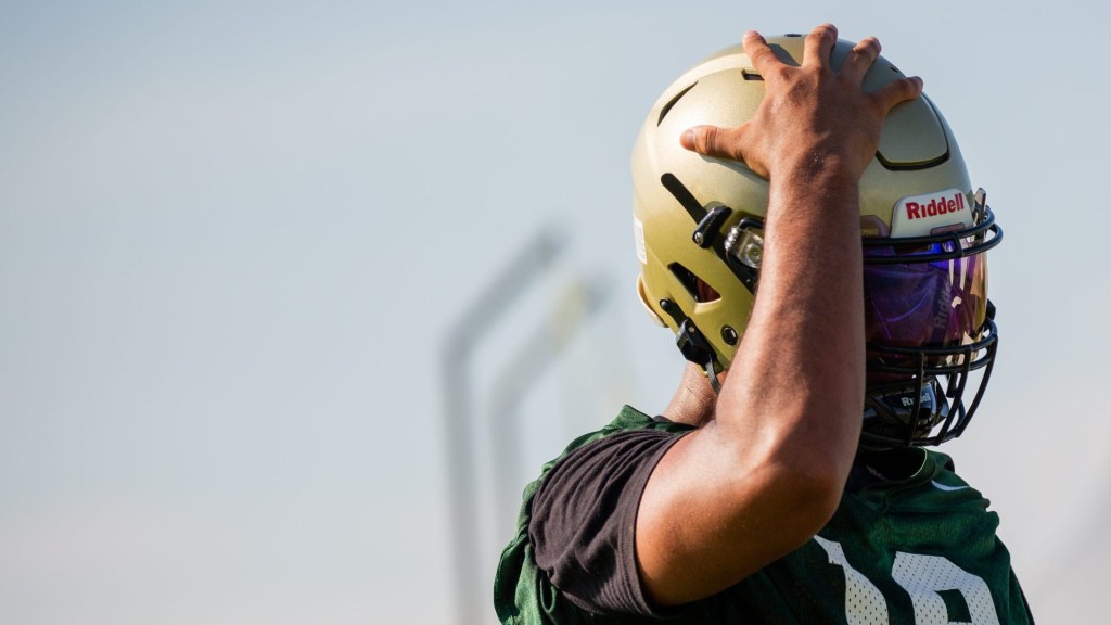 Tight end Javery Mayberry adjusts his helmet during the first official day of practice on the Basha High School football field in Chandler on July 31, 2023.