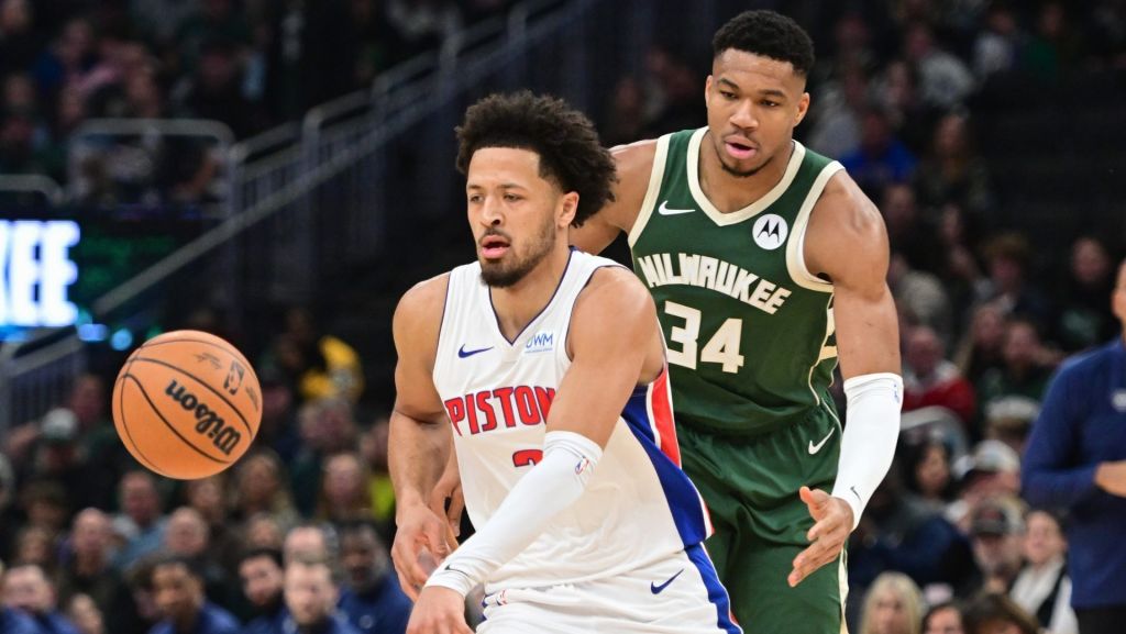 Dec 16, 2023; Milwaukee, Wisconsin, USA; Detroit Pistons guard Cade Cunningham (2) is guarded by Milwaukee Bucks forward Giannis Antetokounmpo (34) in the first quarter at Fiserv Forum. Mandatory Credit: Benny Sieu-USA TODAY Sports