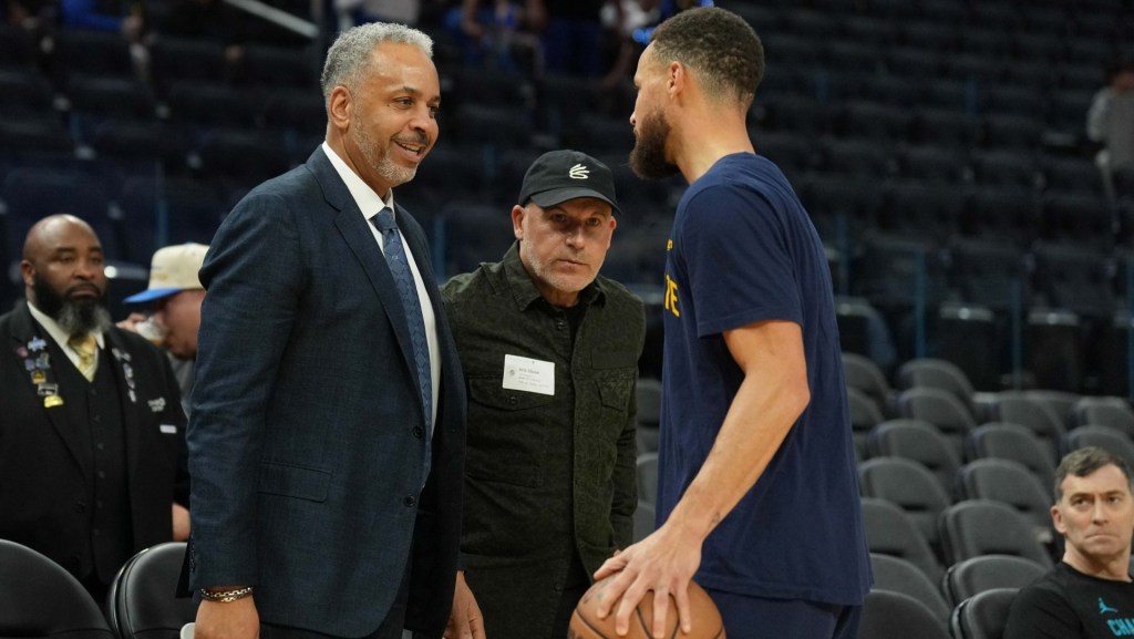 Feb 23, 2024; San Francisco, California, USA; Charlotte Hornets color commentator Dell Curry (left) talks with Golden State Warriors guard Stephen Curry (right) before the game at Chase Center. Mandatory Credit: Darren Yamashita-USA TODAY Sports