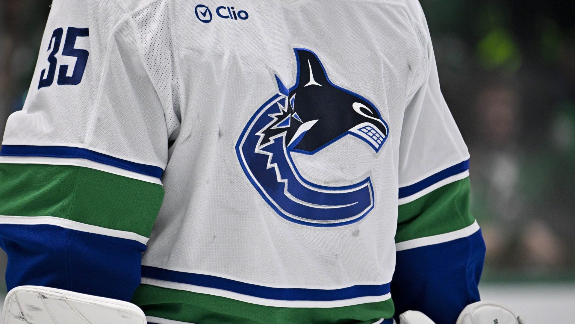 Jan 31, 2025; Dallas, Texas, USA; A view of the team logo on the jersey of Vancouver Canucks goaltender Thatcher Demko (35) during the game between the Dallas Stars and the Vancouver Canucks at the American Airlines Center. Mandatory Credit: Jerome Miron-Imagn Images