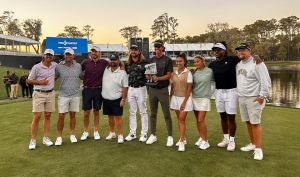 The participants in the first Content Creator Classic at TPC Sawgrass after Grant Horvat (with trophy) won with a birdie putt at the par-3 17th hole of the Players Stadium Course at TPC Sawgrass on March 12.