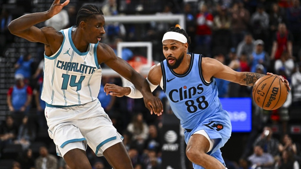 Mar 16, 2025; Inglewood, California, USA; LA Clippers guard Patty Mills (88) moves the ball against Charlotte Hornets forward Moussa Diabate (14) during the second half at Intuit Dome. Mandatory Credit: Jonathan Hui-Imagn Images