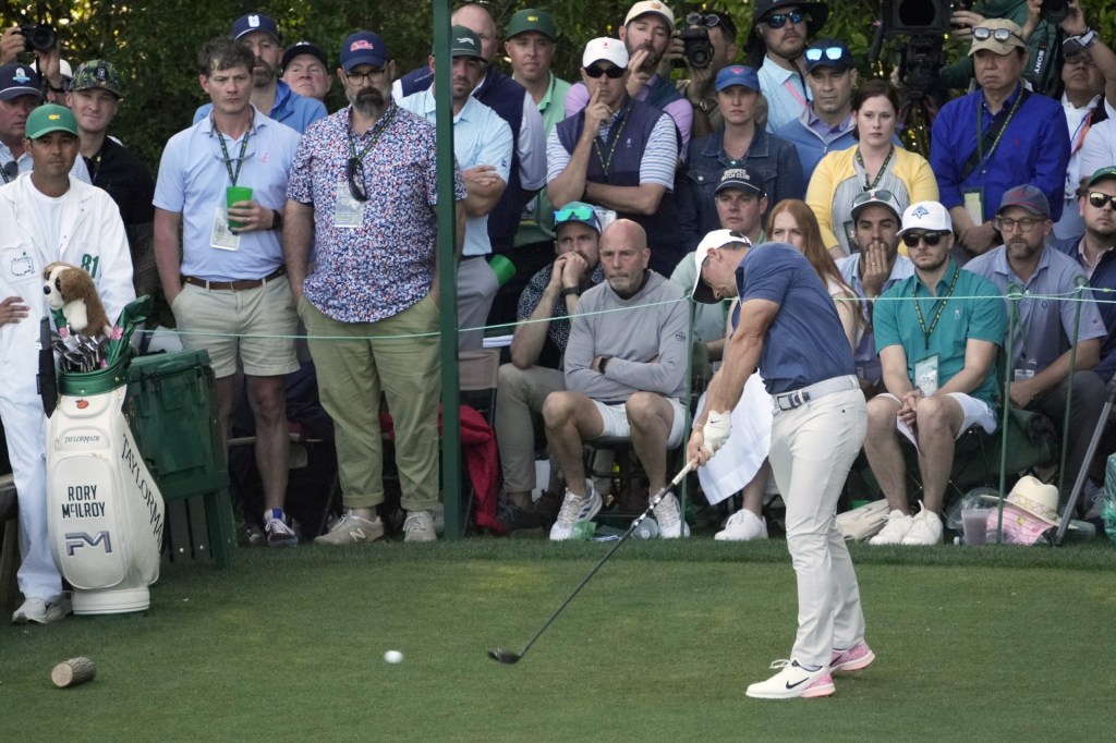 Apr 13, 2025; Augusta, Georgia, USA; Rory McIlroy plays his shot from the 14th tee during the final round of the Masters Tournament at Augusta National Golf Club.
