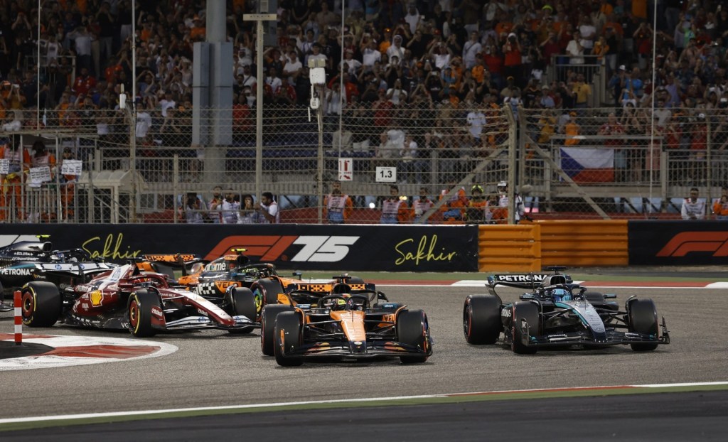 [US, Mexico & Canada customers only] April 13, 2025; Sakhir, BAHRAIN; Oscar Piastri leads George Russell into the first corner at the start of the race during the F1 Bahrain Grand Prix at the Bahrain International Circuit.