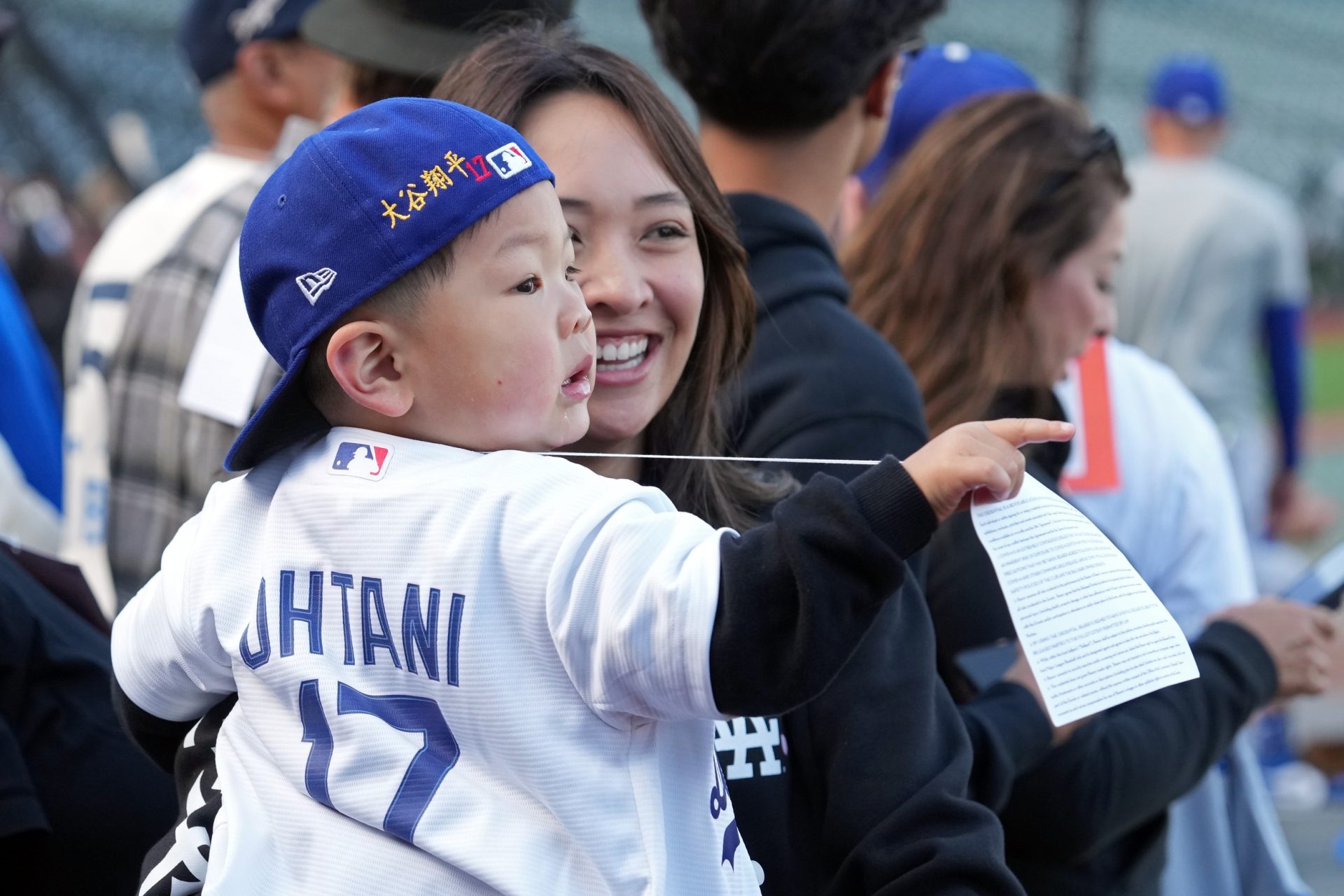 Sep 12, 2025; San Francisco, California, USA; A young fan gestures while wearing a jersey and hat of Los Angeles Dodgers two-way player Shohei Ohtani (17) before the game against the San Francisco Giants at Oracle Park.