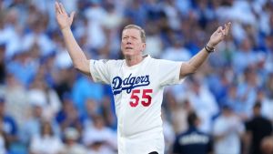 Oct 28, 2025; Los Angeles, California, USA; Los Angeles Dodgers former player Orel Hershiser reacts after throwing the ceremonial first pitch before game four of the 2025 MLB World Series between the Toronto Blue Jays and the Los Angeles Dodgers at Dodger Stadium. Mandatory Credit: Kirby Lee-Imagn Images
