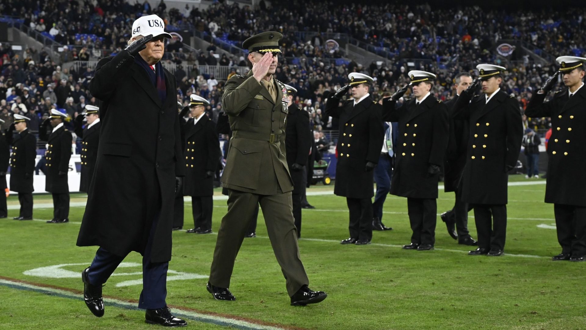 Dec 13, 2025; Baltimore, Maryland, USA; President Donald J Trump cross the field at half time of the game between the Navy Midshipmen and the Army West Point Black Knights at M&T Bank Stadium.