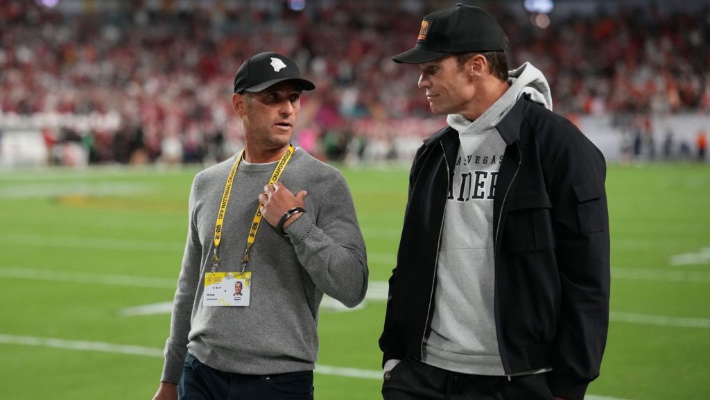 Jan 19, 2026; Miami Gardens, FL, USA; Egon Durban walks on the sideline with Tom Brady before the CFP National Championship college football game between the Indiana Hoosiers and the Miami Hurricanes at Hard Rock Stadium. Mandatory Credit: Kirby Lee-Imagn Images