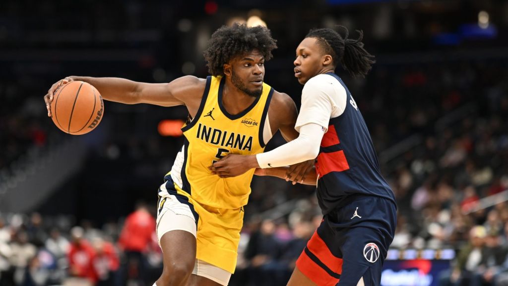 Feb 20, 2026; Washington, District of Columbia, USA; Indiana Pacers forward Jarace Walker (5) drives against Washington Wizards guard Bub Carrington (7) during the fourth quarter at Capital One Arena.