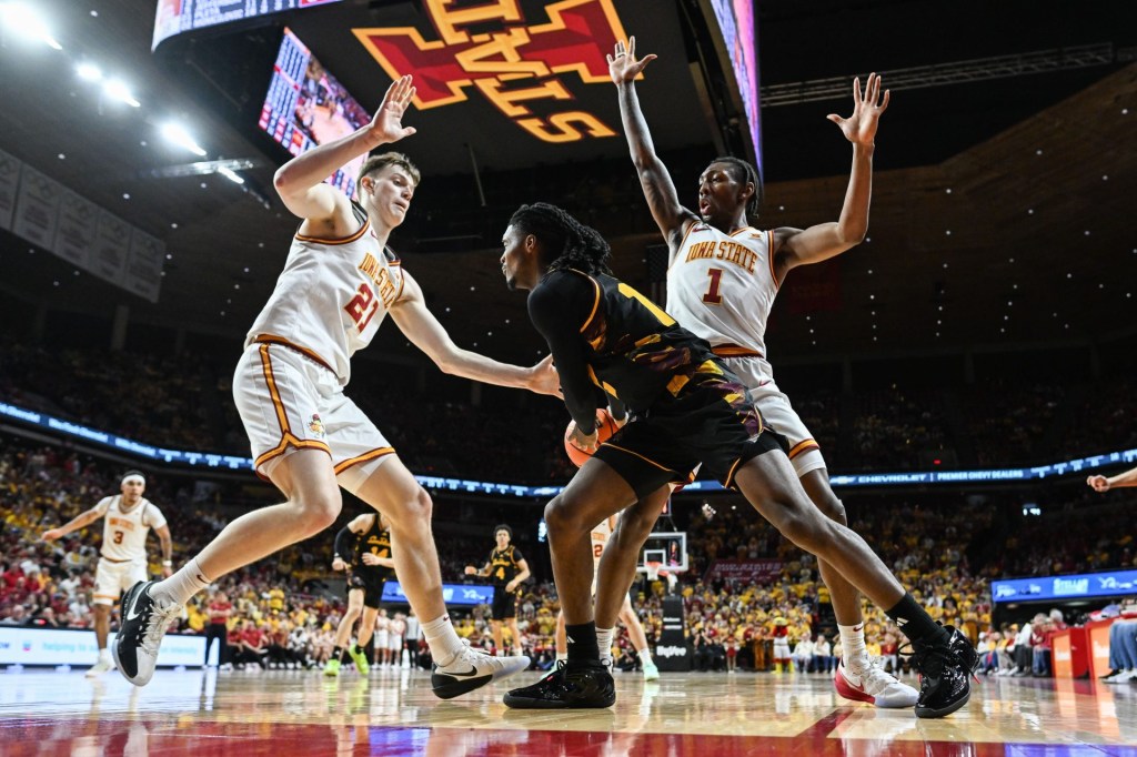 Mar 7, 2026; Ames, Iowa, USA; Arizona State Sun Devils guard Trevor Best (12) is defended by Iowa State Cyclones guard Jamarion Batemon (1) and forward Dominykas Pleta (21) during the second half at James H. Hilton Coliseum.