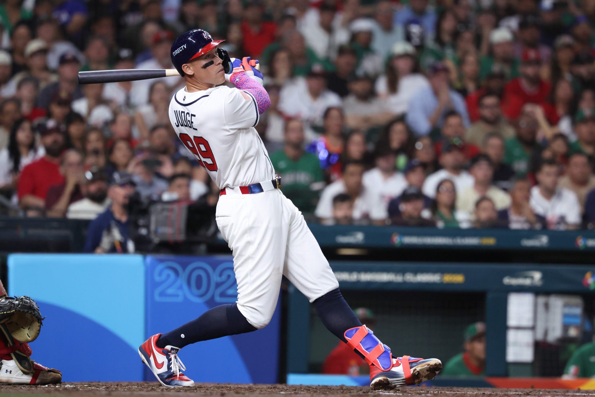 Mar 9, 2026; Houston, TX, United States; United States outfielder Aaron Judge (99) hits a two run home run in the third inning against Mexico at Daikin Park.