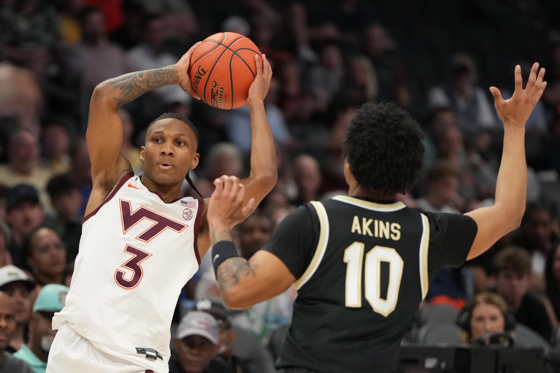 Mar 10, 2026; Charlotte, NC, USA; Virginia Tech Hokies guard Ben Hammond (3) with the ball as Wake Forest Demon Deacons guard Sebastian Akins (10) defends in the second half at Spectrum Center.