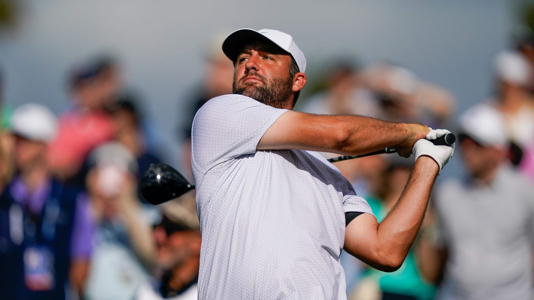 Mar 12, 2026; Ponte Vedra Beach, Florida, USA; Scottie Scheffler plays his tee shot on the 16th hole during the first round of THE PLAYERS Championship golf tournament.
